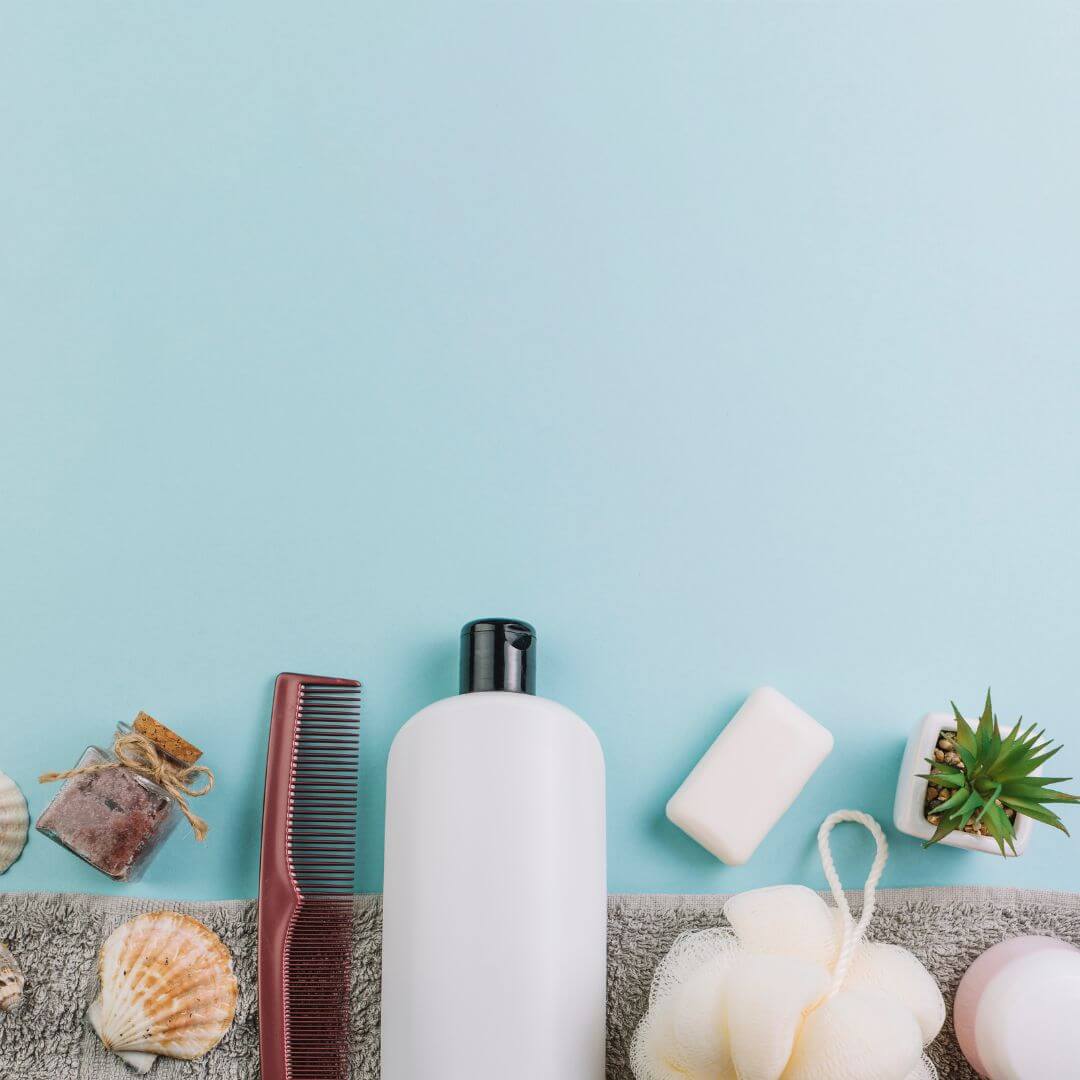 shampoo bottles flat lay for oily hair guide
